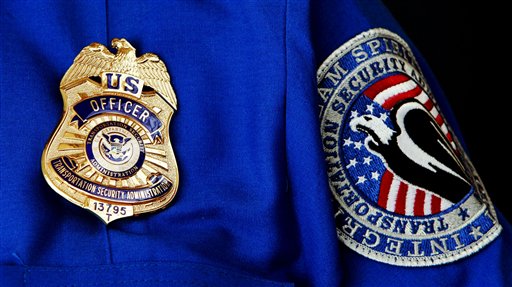 
 FILE - In this June 27, 2008 file photo, TSA Supervisor Jennifer Haslip poses with the new badge and uniforms at Washington's Ronald Reagan National Airport. The TSA has demonstrated a knack for ignoring the basics of customer relations, while struggling with what experts say is an all but impossible task. It must stand as the last line against unknown terror, yet somehow do so without treating everyone from frequent business travelers to the family heading home to visit grandma as a potential terrorist. (AP Photo/Pablo Martinez Monsivais, File)
 