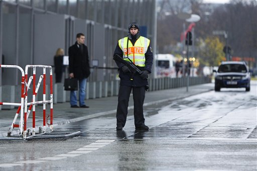 
 A police officer guards an access road at the Reichstag building, Germany's house of parliament, in Berlin on Monday, Nov. 22, 2010. After Germany's Interior Ministry raised the country's terrorist threat level last week, Germany's parliament said it is closing down the cupola of the Reichstag building to visitors over security concerns. (AP Photo/Markus Schreiber)
 