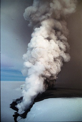 
 FILE - In this Friday, Dec. 18, 1998 file photo clouds of steam spew from beneath Europe's largest glacier, the Vatnajokull glacier, near Grimsvotn in southern Iceland throwing gases an estimated 32,000 feet (9,750 metres) into the air. Torrents of water are pouring from a glacier that sits atop Iceland's most active volcano, an indication that the mountain is growing hotter and may be about to erupt, scientists said Monday, Nov. 1, 2010. The flood that began Thursday at the Grimsvotn volcano is similar to one in 2004 that lasted five days and ended with an eruption that disrupted European air traffic, University of Iceland geophysicist Pall Einarsson said. (AP Photo/Morgunbladet)
 