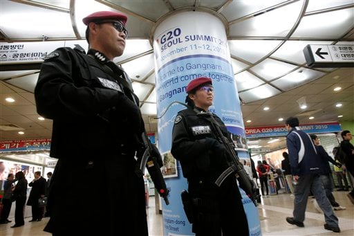 
 South Korean special police officers stand guard against possible terror attacks for the upcoming G-20 summit at a subway station in Seoul, South Korea, Thursday, Nov. 4, 2010. North Korea has been hacking into South Korean government computer networks with greater frequency to gather information on next week's meeting of world leaders in Seoul, a South Korean newspaper reported Thursday. (AP Photo/Ahn Young-joon)
 