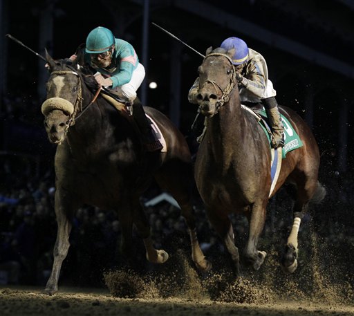 
 Mike Smith, left, is comforted after riding Zenyatta to a second place finish in the Classic race at the Breeder's Cup horse races at Churchill Downs Saturday, Nov. 6, 2010, in Louisville, Ky. (AP Photo/Darron Cummings)
 