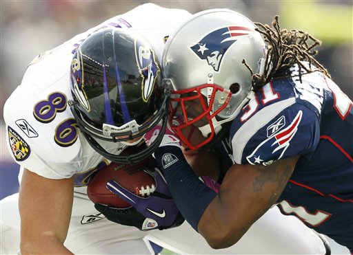 
 FILE - This Oct. 17, 2010, file photo shows Baltimore Ravens tight end Todd Heap, left, taking a hit from New England Patriots safety Brandon Meriweather, right, during an NFL football game at Gillette Stadium in Foxborough, Mass. The NFL's brain, neck and spine committee meets Wednesday, Dec. 8, 2010, to talk about possible changes to helmets and other equipment. (AP Photo/Winslow Townson, File)
 