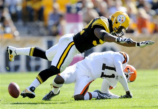 
 FILE - In this Oct. 17, 2010, file photo, Pittsburgh Steelers linebacker James Harrison (92) hits Cleveland Browns wide receiver Mohamed Massaquoi (11) during the second quarter of a an NFL football game in Pittsburgh. Harrison was fined $75,000, for his hit against Massaquoi. The NFL's brain, neck and spine committee meets Wednesday, Dec. 8, 2010, to talk about possible changes to helmets and other equipment. (AP Photo/Don Wright, File)
 