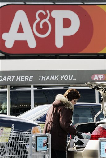 
 FILE - In this March 5, 2007 file photo, a shopper loads groceries into her car outside an A&P store, in Wall Township, N.J. The Great Atlantic & Pacific Tea Co., once the nation's largest grocer, has filed for Chapter 11 bankruptcy protection Monday, Dec. 13, 2010, as it struggles with enormous debt and increased competition from low-priced peers. (AP Photo/Mel Evans, file)
 