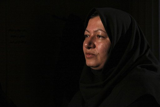 
 In this photo released by state-run Press TV, Sakineh Mohammadi Ashtiani, sentenced to death by stoning for adultery, sits for an interview with Press TV in Tabriz, Iran, Sunday, Dec. 5, 2010. The 43-year-old mother of two was brought from the prison to her home in northwestern Iran to 'produce a visual recount of the crime at the murder scene,' Press TV announced, denying reports that she had been released. (AP Photo/Press TV) EDS NOTE: THE ASSOCIATED PRESS HAS NO WAY OF INDEPENDENTLY VERIFYING THE CONTENT, LOCATION OR DATE OF THIS IMAGE.
 
