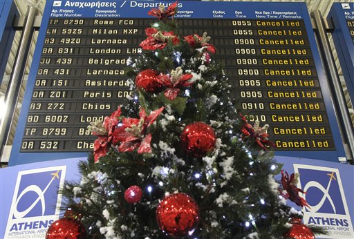 
 Departure board shows canceled flights behind a Christmas tree at the Athens International Airport Eleftherios Venizelos during a 24-hour strike in Spata, near Athens, Wednesday, Dec. 15, 2010. A general strike hit Greece Wednesday, grounding flights and disrupting hospital and transport services as unions protest against the freshly approved labor reforms amid painful austerity and rising unemployment. (AP Photo/Thanassis Stavrakis)
 