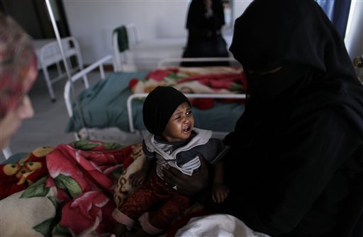 
 A Yemeni girl suffering from chronic malnutrition reacts while held by her mother as they wait for a doctor in a hospital in Sanaa, Yemen, Wednesday, Nov. 10, 2010. More than 50 percent of Yemen's children are malnourished, rivalling war zones like Sudan's Darfur and parts of sub-Saharan Africa. That's just one of the worrying statistics in Yemen. Nearly half the population lives below the poverty line of $2 a day and doesn't have access to proper sanitation. Less than a tenth of the roads are paved. Water is running out. Tens of thousands have been displaced from their homes by conflict, flooding into cities. The government is riddled with corruption, has little control outside the capital, and its main source of income _ oil _ could run dry in a decade. (AP Photo/Muhammed Muheisen)
 