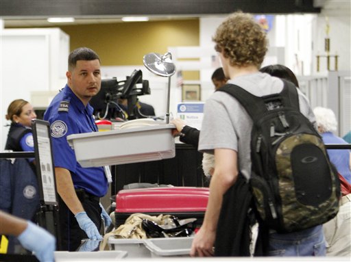 
 A TSA officer checks passengers personal belongings at the X-ray machine at Miami International Airport in Miami, Thursday, Dec. 23, 2010. (AP Photo/Alan Diaz)
 