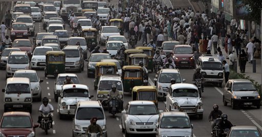 
 In this Monday, Nov. 1, 2010 photo, haphazard traffic is seen in New Delhi, India. Around 10 million cars, buses, trucks and an army of scooters and motorbikes pack into the cities potholed roads each day, causing unending traffic jams, frayed tempers and gridlock. A global road safety report by the World Health Organization says more people die in road accidents in India than anywhere else in the world, a phenomenon blamed on poor roads, speeding, and dangerous and reckless driving. (AP Photo/Manish Swarup)
 