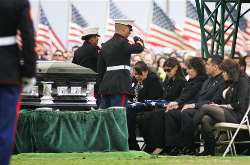 
 FILE - In this March 8, 2010 file photo, Marines salute Saloma Bejar and Mariam Bejar, the mother and wife of fallen officer Javier Bejar, after presenting the ceremonial flag at cemetery services in Reedley, Calif. Cluster killings of more than one officer helped make 2010 a particularly dangerous year for police officers. Some 160 officers died in the line of duty, a 37 percent jump from the same period in 2009 when 117 officers were killed, according to statistics compiled by the National Law Enforcement Officers Memorial Fund, a nonprofit that tracks police deaths. (AP Photo/Gary Kazanjian, File)
 