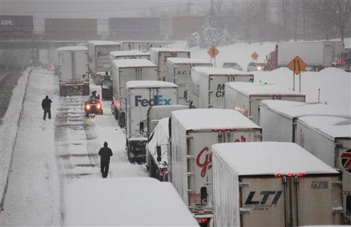 
 Truck driver John Joyce waits in a long line of stranded vehicles on the New York State Thruway during a winter storm in Buffalo, N.Y., Thursday, Dec. 2, 2010. (AP Photo/David Duprey)
 