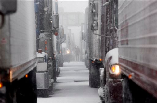 
 Vehicles are stranded on the New York State Thruway during a winter storm in Buffalo, N.Y., Thursday, Dec. 2, 2010. (AP Photo/David Duprey)
 