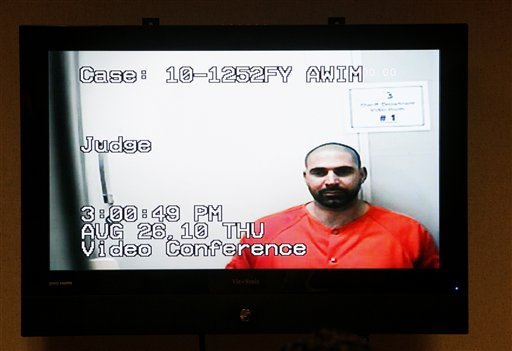
 Elias Abuelazam is shown on a monitor during his video arraignment at 68th District Court in Flint, Mich., Thursday, Aug. 26, 2010. Abuelazam was ordered held without bond Thursday after being extradited to Michigan. The 33-year-old is charged with assault with intent to commit murder in the July 27 stabbing of a 26-year-old Flint man. It's one of 14 stabbings, of men in the Flint area, about 70 miles northwest of Detroit. He's also suspected in similar stabbings in Virginia and Ohio.(AP Photo/Paul Sancya)
 