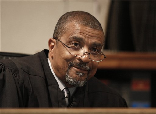 
 Judge Nathaniel C. Perry III is shown during Elias Abuelazam's video arraignment at 68th District Court in Flint, Mich., Thursday, Aug. 26, 2010. Abuelazam was ordered held without bond Thursday after being extradited to Michigan. The 33-year-old is charged with assault with intent to commit murder in the July 27 stabbing of a 26-year-old Flint man. It's one of 14 stabbings, of men in the Flint area, about 70 miles northwest of Detroit. He's also suspected in similar stabbings in Virginia and Ohio. (AP Photo/Paul Sancya)
 