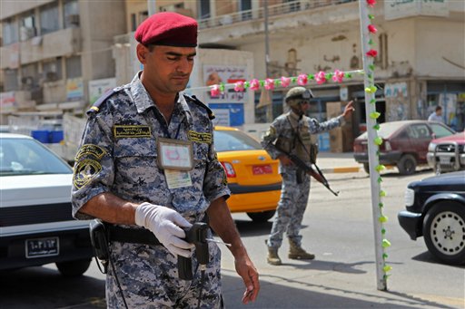 
 An Iraqi police officer uses a bomb detector at a checkpoint in central Baghdad, Iraq, Saturday, Aug. 28, 2010. The Iraqi prime minister put his nation on its highest alert for terror attacks, as insurgents hammer Iraqi security forces preparing to take over for a U.S. combat mission that formally ends on Tuesday. (AP Photo/Khalid Mohammed)
 