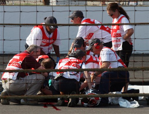 
 ** EDS NOTE GRAPHIC CONTENT ** Peter Lenz, of Vancouver, Wash., is treated by medical personnel after a crash Sunday, Aug. 29, 2010, in a motorcycle race that took place before the MotoGP event at Indianapolis Motor Speedway in Indianapolis, Sunday, Aug. 29, 2010. Lenz fell off his bike and was run over by another motorcycle. He was pronounced dead later Sunday. (AP Photo/Jimmy Dawson)
 