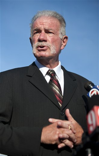 
 Pastor Terry Jones of the Dove World Outreach Center makes comments to reporters prior to a service at his church in Gainesville, Fla., Wednesday, Sept. 8, 2010. Jones stated that he is going forward with a scheduled burning of copies of the Quran at his church on Saturday, Sept. 11.(AP Photo/John Raoux)
 