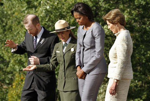 
 ** CORRECTS DIRECTION IN PHOTO OF MICHELLE OBAMA AND LAURA BUSH, TO SECOND FROM RIGHT, AND RIGHT, RESPECTIVELY ** First Lady Michelle Obama, second from right, and former First Lady Laura Bush, right, tour the construction site at the Flight 93 memorial with Gordon W. Felt, president of the Families of Flight 93, left, who lost his brother Edward Felt on the flight, and Joanne M. Hanley, superintendent of the Flight 93 National Memorial before a commemorative service at the temporary Flight 93 temporary memorial in Shanksville, Pa., Saturday, Sept. 11, 2010. (AP Photo/Gene J. Puskar)
 
