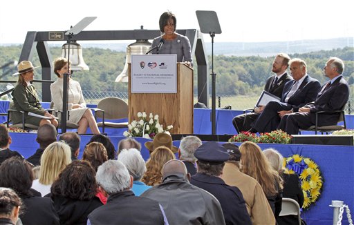 
 First lady Michelle Obama, center, speaks during a commemorative service at the temporary Flight 93 memorial in Shanksville, Pa., Saturday, Sept. 11, 2010. From left are, Joanne M. Hanley, superintendent of the Flight 93 National Memorial., former first lady Laura Bush, Mrs. Obama, Gordon W. Felt, president of the Families of Flight 93, Pennsylvania Gov. Ed Rendell, and Interior Secretary Ken Salazar. (AP Photo/Gene J. Puskar)
 