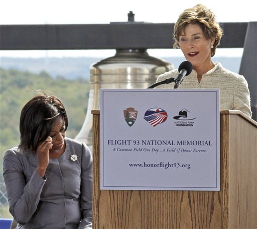 
 Former first lady Laura Bush, right, makes her remarks as first lady Michelle Obama listens during a commemorative service at the temporary Flight 93 memorial in Shanksville, Pa., Saturday, Sept. 11, 2010. (AP Photo/Gene J. Puskar)
 