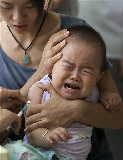 
 A baby cries while receiving a vaccination injection against measles at a clinic in Beijing, China, Saturday, Sept. 11, 2010. China wants to vaccinate nearly 100 million children in a 10-day nationwide campaign starting Saturday to bring it a step closer to eradicating measles. (AP Photo/Alexander F. Yuan)
 