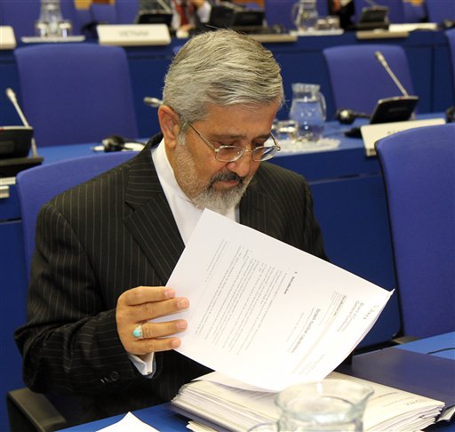 
 Iran's Ambassador to the International Atomic Energy Agency, IAEA, Ali Asghar Soltanieh, ckecks his papers prior to start of the IAEA's board of governors meeting at the International Center, in Vienna, Austria, on Wednesday, Sept. 15, 2010. (AP Photo/Ronald Zak)
 