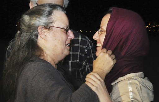 
 ** RETRANSMISSION FOR ALTERNATE CROP OF CAI103 ** Sarah Shourd, 32, of the U.S., right, embraces her mother Nora Shourd, left, on Sarah Shourd's arrival at the royal airport in Muscat, Oman, Tuesday, Sept. 14, 2010, after leaving Tehran, Iran. The American woman released by Iran on Tuesday after more than a year in prison said she was grateful to Iran's president for her freedom shortly before she boarded a flight to the Gulf sultanate of Oman where her mother greeted her with a warm embrace. (AP Photo/Sultan al-Hasani)
 