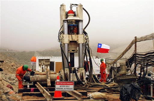 
 In this photo released by Chile's government, men work on a new drill to be used in the rescue operation of 33 trapped miners at the San Jose mine in Copiapo, Chile, Tuesday Aug. 31, 2010. Thirty-three men stuck far underground are now the longest-trapped miners in recent history as a huge drill begins digging a planned escape route. The miners have been trapped since Aug. 5. (AP Photo/Chilean Government)
 