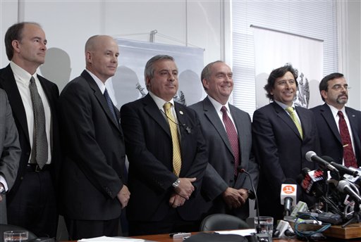 
 NASA team members Albert W. Holland, left, and Clint Cragg, second left, Health Minister Jaime Manalich, third from left, NASA's Deputy Chief Medical Officer Dr. Michael Duncan, fourth from left, Chile's Mining Minister Laurence Golborne, fifth from left, and NASA's Chief Medical Officer James Davis Polk pose for photographs after a press conference regarding the 33 trapped miners in Santiago, Chile, Tuesday Aug. 31, 2010. A NASA team will give advice based on the U.S. space agency's experience in helping astronauts through the ordeals of living for as long as a year in cramped quarters and with limited contact with friends and family. (AP Photo/Aliosha Marquez)
 