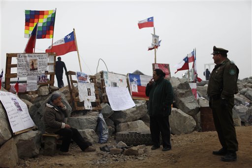 
 Relatives of miners trapped alive in the San Jose mine gather at a camp outside the collapsed mine in Copiapo, Chile, Tuesday Aug. 31, 2010. Thirty-three men stuck far underground are now the longest-trapped miners in recent history as a huge drill begins digging a planned escape route. The miners have been trapped since Aug. 5. (AP Photo/Roberto Candia)
 