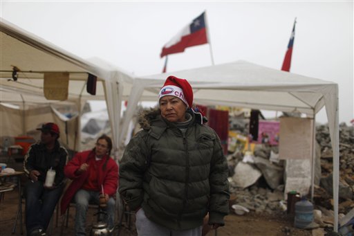 
 Elizabeth Segovia, sister of trapped miner Dario Segovia, stands at the camp where relatives wait outside the collapsed San Jose mine in Copiapo, Chile, Tuesday Aug. 31, 2010. Thirty-three men stuck far underground are now the longest-trapped miners in recent history as a huge drill begins digging a planned escape route. The miners have been trapped since Aug. 5. (AP Photo/Roberto Candia)
 