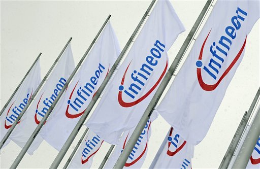 
 FILE - In this Feb. 12, 2009 file photo, flags with the company logo of Infineon Technologies are seen prior to the annual shareholders meeting in Munich, southern Germany. German chipmaker Infineon Technologies AG is selling a unit that makes products for wireless telephones to California's Intel Corp. in a $1.4 billion cash deal, the companies said Monday, Aug. 30, 2010. (AP Photo/Uwe Lein, File)
 