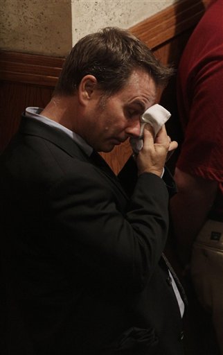 
 A man cries during a memorial service for Jacqueline Greig and her 13-year-old daughter Janessa, who were both killed in the San Bruno fire last week, at St. Cecilia Church in San Francisco, Thursday, Sept. 16, 2010. (AP Photo/Jeff Chiu)
 