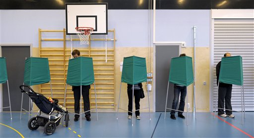 
 Voters fill the booths at a polling station during general elections in Stockholm, Sweden Sunday Sept. 19, 2010. Voting started Sunday in Sweden's election with polls showing the center-right government heading for a historic second term, but an Islam-bashing far-right group could spoil its majority. (AP Photo / Janerik Henriksson)
 