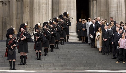 
 Scottish bagpipers stand on the steps and play outside the memorial service for Alexander McQueen at St Paul's Cathedral in London, Monday, Sept. 20, 2010, which takes place during London Fashion Week. (AP Photo/Joel Ryan)
 