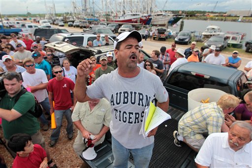 
 FILE - In this July 5, 2010 file photo, Chris LaForce talks with other fisherman during a protest meeting at the city docks in Bayou La Batre, Ala. Retired Coast Guard Adm. Thad Allen, the federal government's point man on the disaster, said Sunday, Sept. 19, 2010, BP's well 'is effectively dead.' A permanent cement plug sealed BP's well nearly 2.5 miles below the sea floor in the Gulf of Mexico, five agonizing months after an explosion sank a drilling rig and led to the worst offshore oil spill in U.S. history. (AP Photo/Dave Martin, File)
 