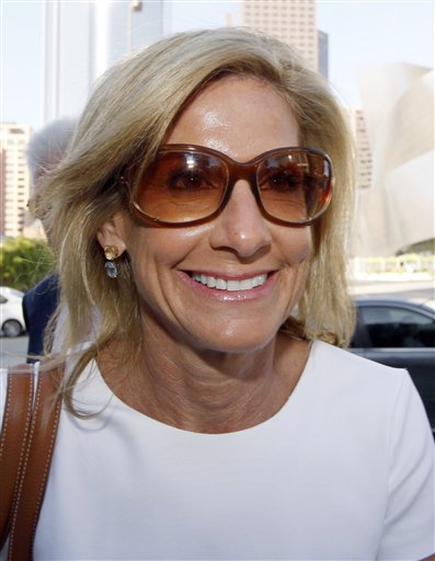 
 Jamie McCourt arrives at a Los Angeles courthouse Monday, Aug 30, 2010 at the start of her non-jury divorce trial with her husband Frank McCourt. Jamie McCourt's lawyers say the former Dodger CEO would never give up her stake in the team and they've suggested copies of the agreement were altered to give Frank McCourt sole control of the Dodgers, the stadium and surrounding land. (AP Photo/Nick Ut)
 