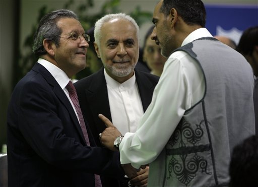 
 Imam Feisal Abdul Rauf, middle, talks to Dr, Tarik Yousef, Dean of the Dubai School of Government during an Iftar ceremony hosts by Dubai School of Government in Dubai, United Arab Emirates,Tuesday Aug. 31, 2010. (AP Photo/Kamran Jebreili)
 