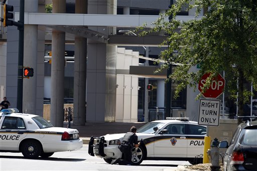 
 Police block the street in front of the headquarters of the Discovery Channel networks building in Silver Spring, Md., Wednesday Sept. 1, 2010. Police say a gunman has taken at least one person hostage in the building. (AP Photo/Jose Luis Magana)
 