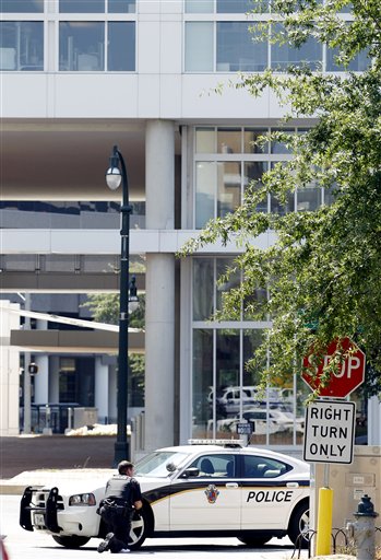 
 Police block the street in front of the headquarters of the Discovery Channel networks in Silver Spring, Md., Wednesday Sept. 1, 2010. Police say a gunman has taken at least one person hostage in the building. (AP Photo/Jose Luis Magana)
 
