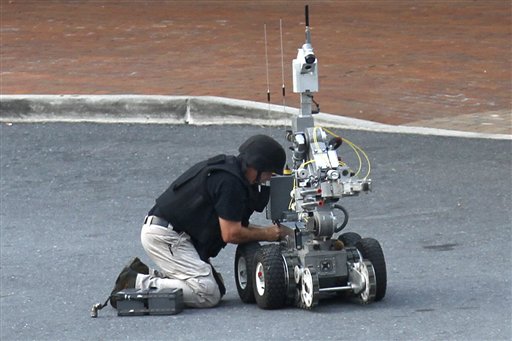 
 An explosives robot is prepared and sent into the Discovery Channel networks building where police shot and killed a gunman who took hostages in Silver Spring, Md., on Wednesday, Sept. 1, 2010. (AP Photo/Jacquelyn Martin)
 