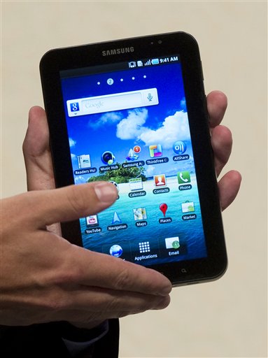 
 Thomas Richter, Head of Portfolio Management for Telecommunications Europe of Samsung presents the new Samsung Galaxy Tab, a tablet computer to compete with the Apple iPad, at IFA, the world's largest trade fair for consumer electronics and electrical home appliances, in Berlin, Germany, Thursday, Sept. 2, 2010. IFA takes place from Sept. 3 to Sept. 8, 2010 at the Berlin Exhibition Grounds. (AP Photo/Gero Breloer)
 