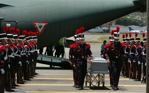 
 Soldiers unload coffins containing the remains of 16 Hondurans who were killed in Mexico while trying to reach the U.S. border, in Tegucigalpa, Honduras, Wednesday Sept. 1, 2010. The bodies of 72 Central and South American migrants, who were allegedly killed by a Mexican drug cartel, were found within 100 miles of the U.S. border on Aug. 24. (AP Photo/Fernando Antonio)
 