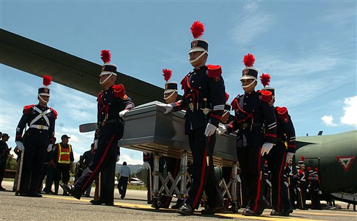 
 Soldiers unload from a plane coffins containing the remains of 16 Hondurans who were killed in Mexico while trying to reach the U.S. border, in Tegucigalpa, Honduras, Wednesday Sept. 1, 2010. The bodies of 72 Central and South American migrants, who were allegedly killed by a Mexican drug cartel, were found within 100 miles of the U.S. border on Aug. 24. (AP Photo/Fernando Antonio)
 