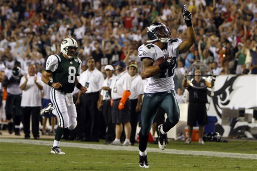 
 Philadelphia Eagles safety Kurt Coleman, right, celebrates as he returns a fumble for a touchdown as New York Jets quarterback Mark Brunell chases in vain during the first half of an NFL preseason football game, Thursday, Sept. 2, 2010, in Philadelphia. (AP Photo/Matt Slocum)
 