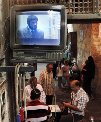 
 The image of Hassan al-Banna, the founder of the Muslim Brotherhood group, is displayed during a TV miniseries, titled 'Al-Gamaa,' or 'The Group,' at a coffee shop in old Cairo, Egypt early Friday, Sept.3, 2010. The miniseries casts a harsh light on the country's largest opposition movement just three months before a crucial parliamentary election that is expected to pit it against President Hosni Mubarak's ruling party. (AP Photo/Amr Nabil)
 
