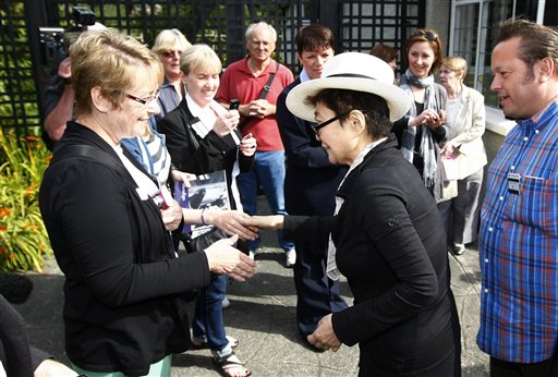 
 John Lennon's widow Yoko Ono, second right, great supporters as she visits his old house in Menlove Avenue, Liverpool, England, Friday, Sept. 3, 2010. (AP Photo/Tim Hales)
 
