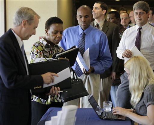
 In this Aug. 31, 2010 file photo, job seekers supply copies of their resumes at a career fair in Rolling Meadows, Ill. (AP Photo/M. Spencer Green)
 