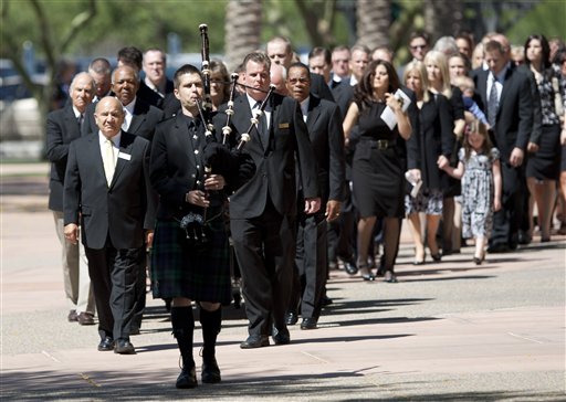 
 A bagpipe player leads the processional for Hall of Famer and former Minnesota Twins' Harmon Killebrew's funeral at Christ's Church of the Valley, Friday, May 20, 2011, in Peoria, Ariz. Killebrew died Tuesday, May 17 of esophageal cancer. He was 74. (AP Photo/The Arizona Republic, David Wallace)
 
