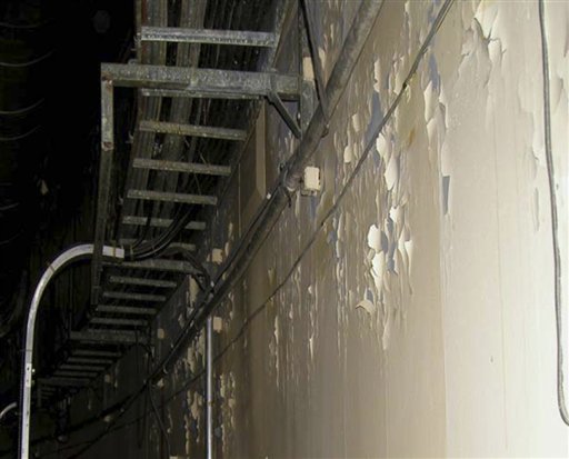 
 This spring 2004 photo made available by the Nuclear Regulatory Commission shows the finish peeling off a wall at the Oconee nuclear plant in South Carolina. An NRC inspector general's report in September 2007 said the operator had failed to manage this aging problem as it promised during relicensing. Even mundane deterioration at a reactor can carry harsh consequences. For example, peeling paint and debris can be swept toward pumps that circulate cooling water in a reactor accident. (AP Photo/Nuclear Regulatory Commission)
 